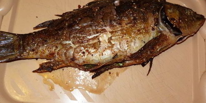 Рецепт ароматного карпа запеченного с зеленью